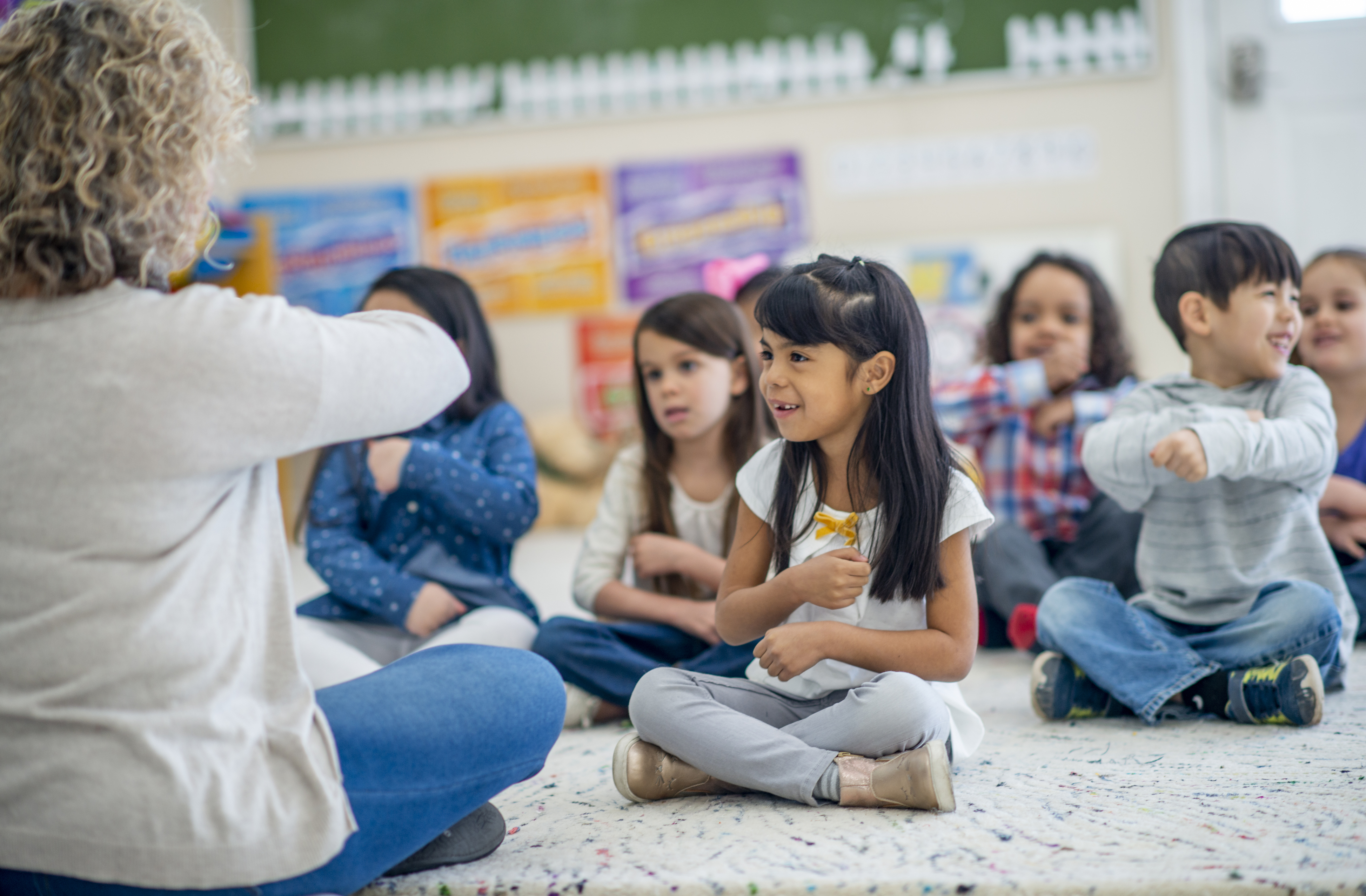 Two pre-k or kindergarten age students coloring