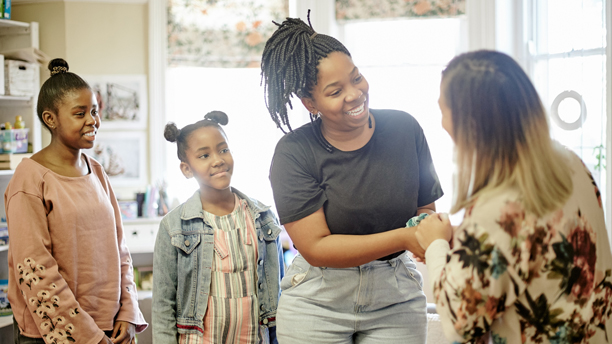 Parent, teacher and kids meeting in classroom at Montessori school for education, learning and teaching